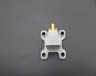 What are the primary design features of a Right Angle Waveguide To Coaxial Adapter?